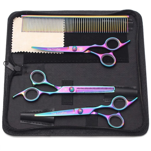 Rainbow finish scissors set laid out in the zip case with a comb