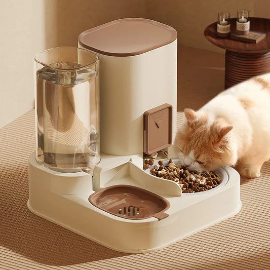 Brown all-in-one pet feeder and waterer with a cream cat eating from the food bowl