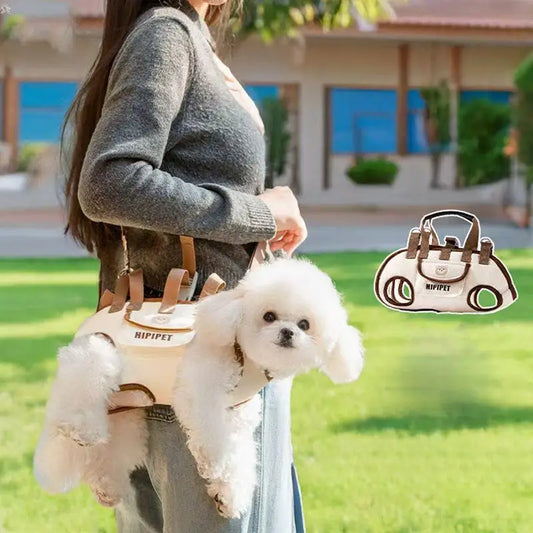 Small white dog riding in the carrier at a person’s hip on a walk