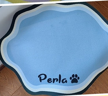 Blue personalised pet feeding mat printed with the name Perla and a paw print