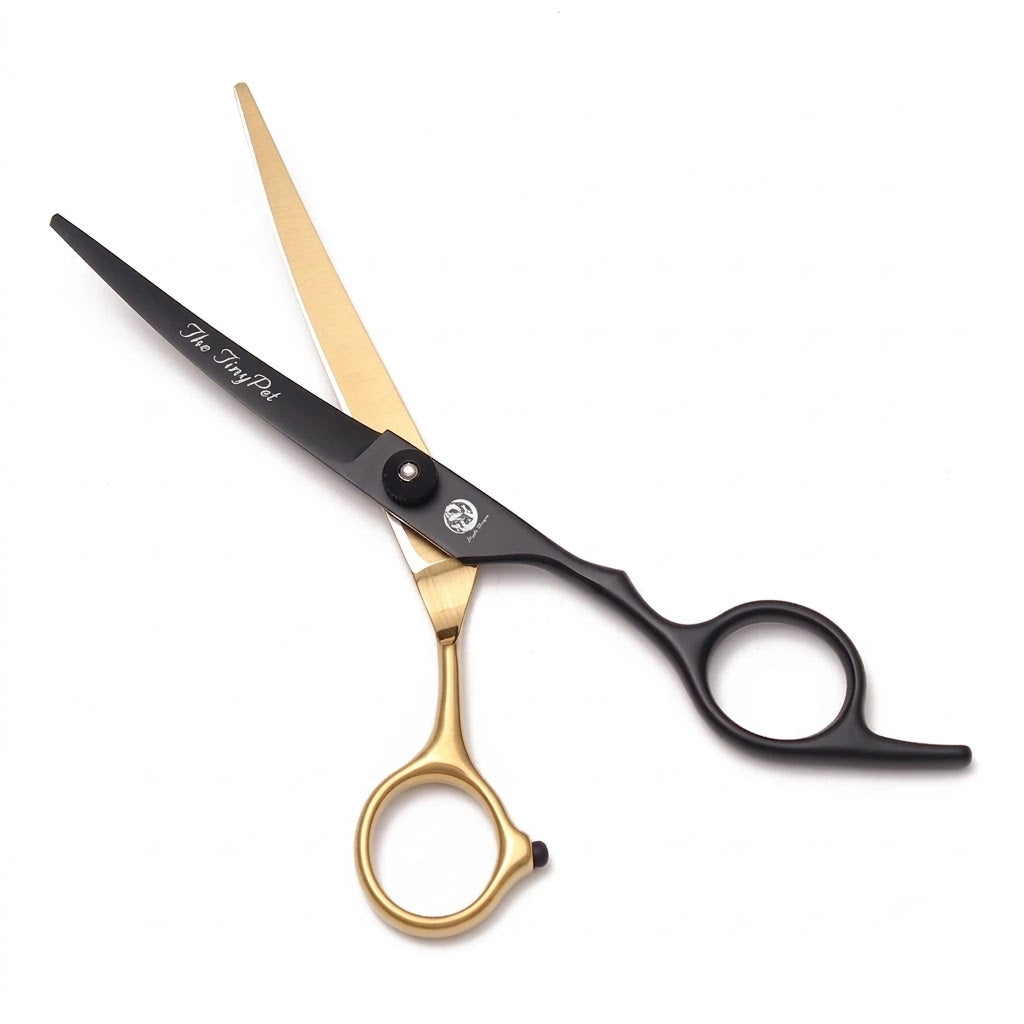 Curved shears with a gold blade and black handle