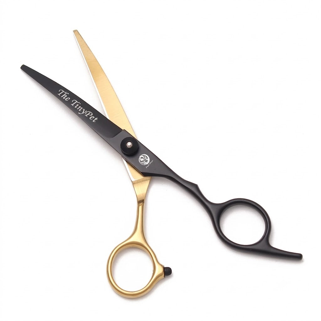 Thinning shears with a toothed blade, black with a gold handle