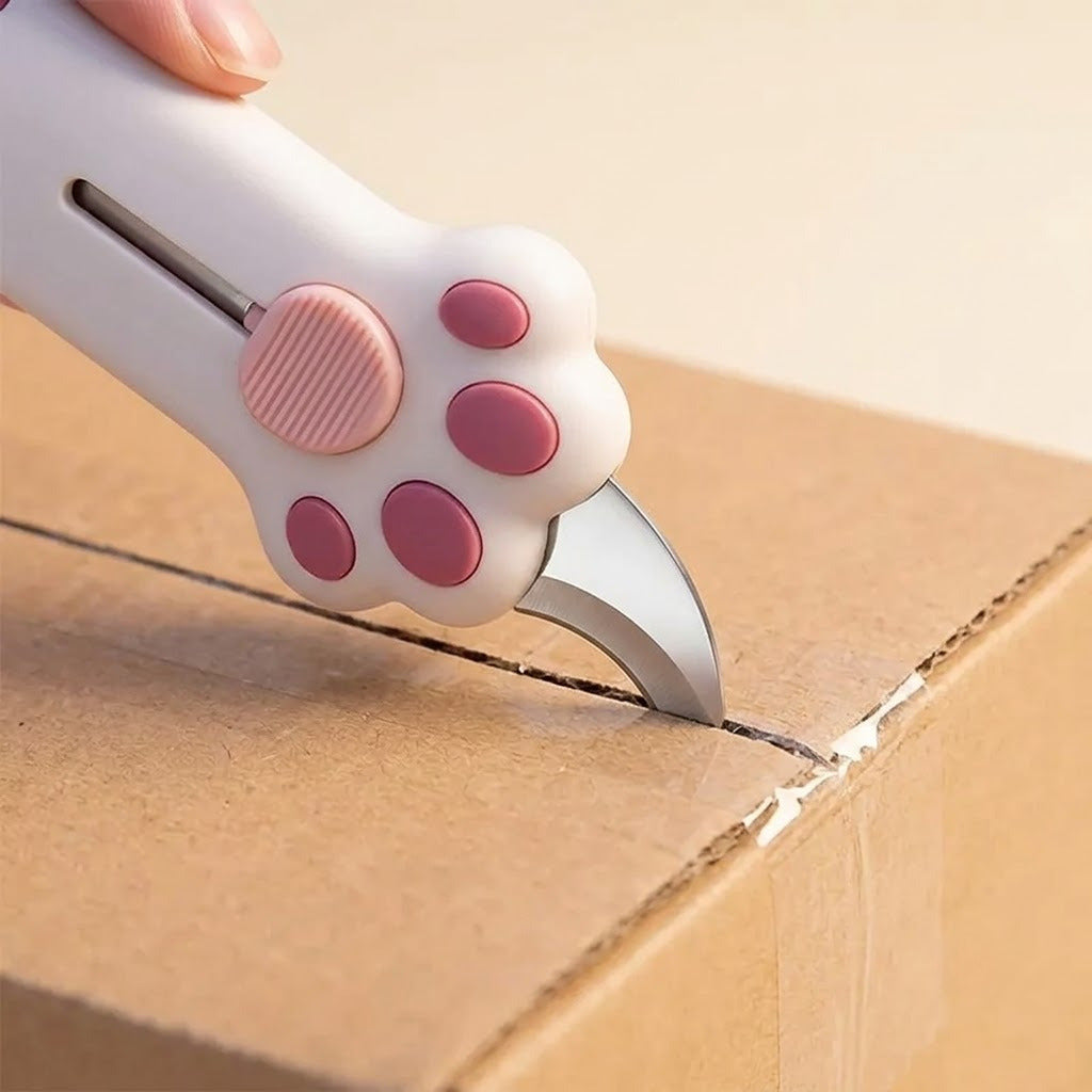 The cutter slicing open a cardboard box