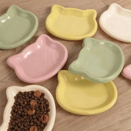 Cat-shaped shallow dishes in cream, pink, yellow and green