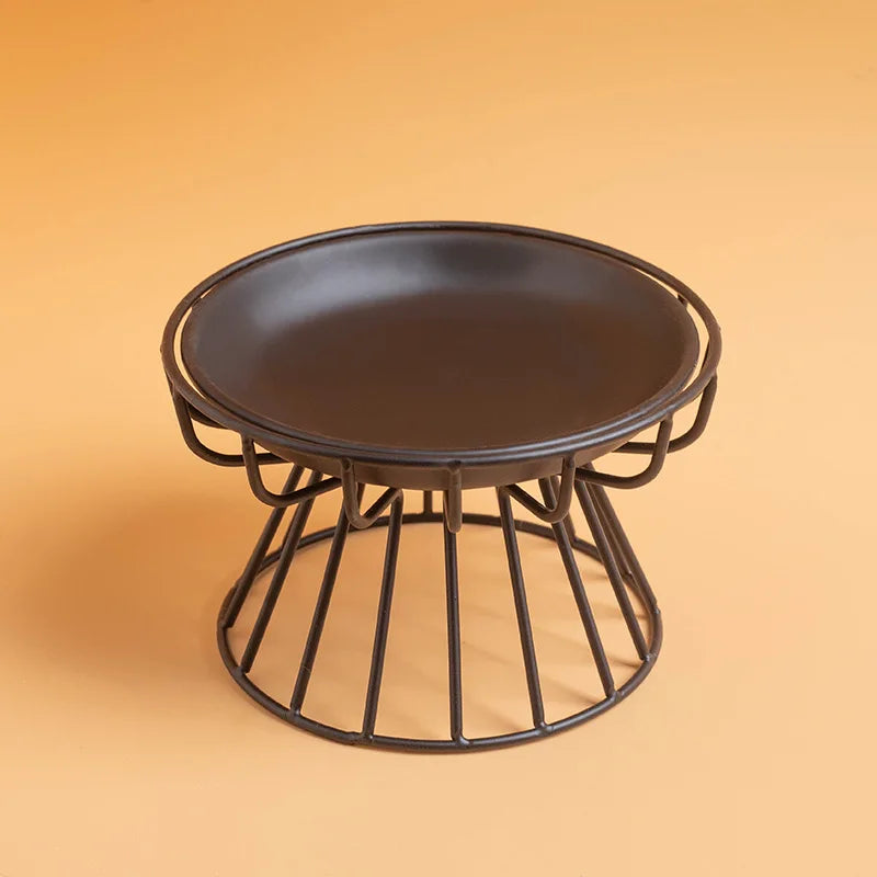 Charcoal ceramic plate on a black wire stand