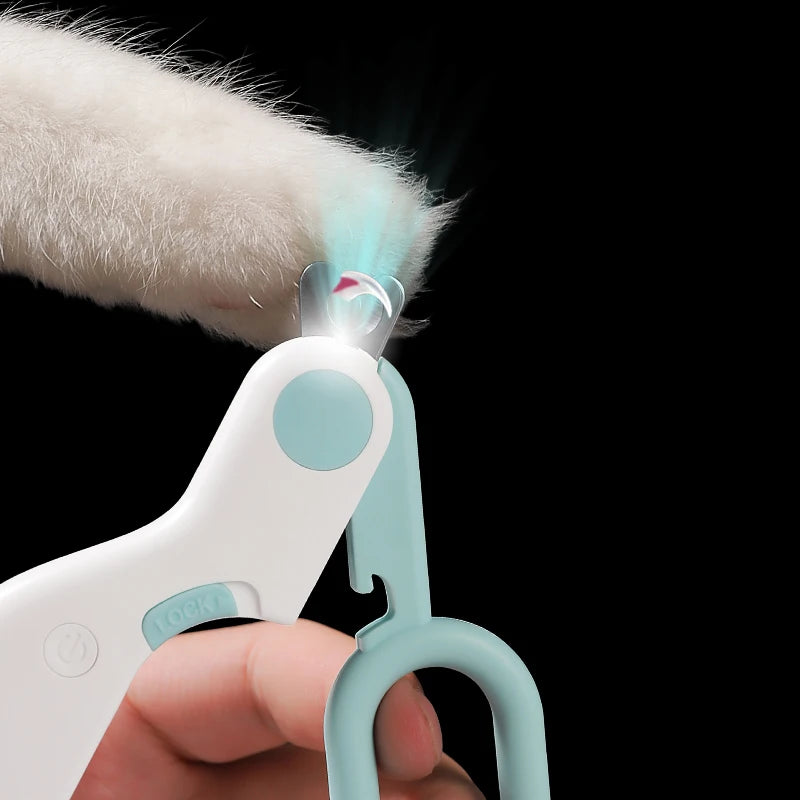 The clipper lighting a cat's claw from underneath