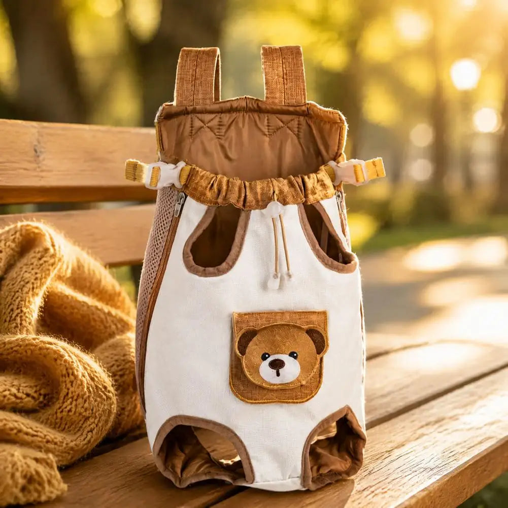 The carrier on a park bench showing the drawstring neck, side buckles and bear pocket