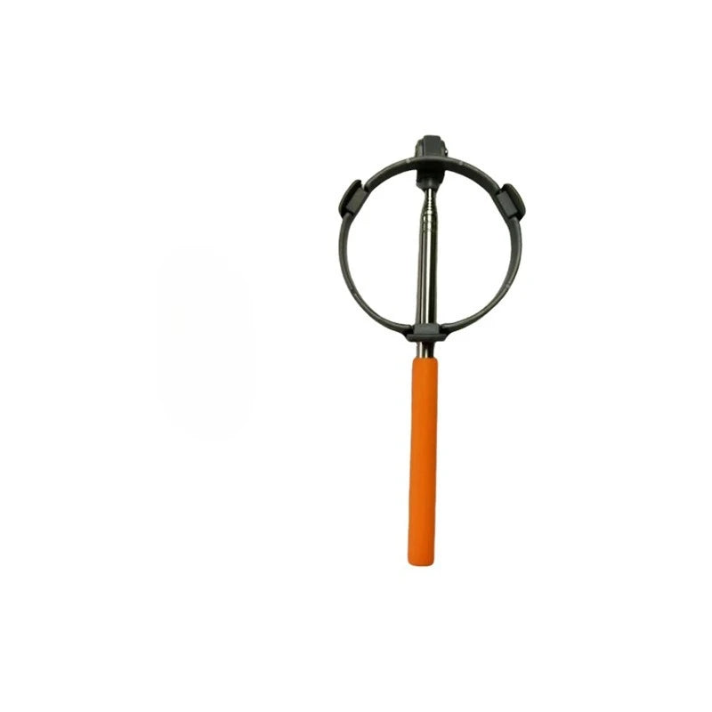 The scooper on its own with the orange rubber grip
