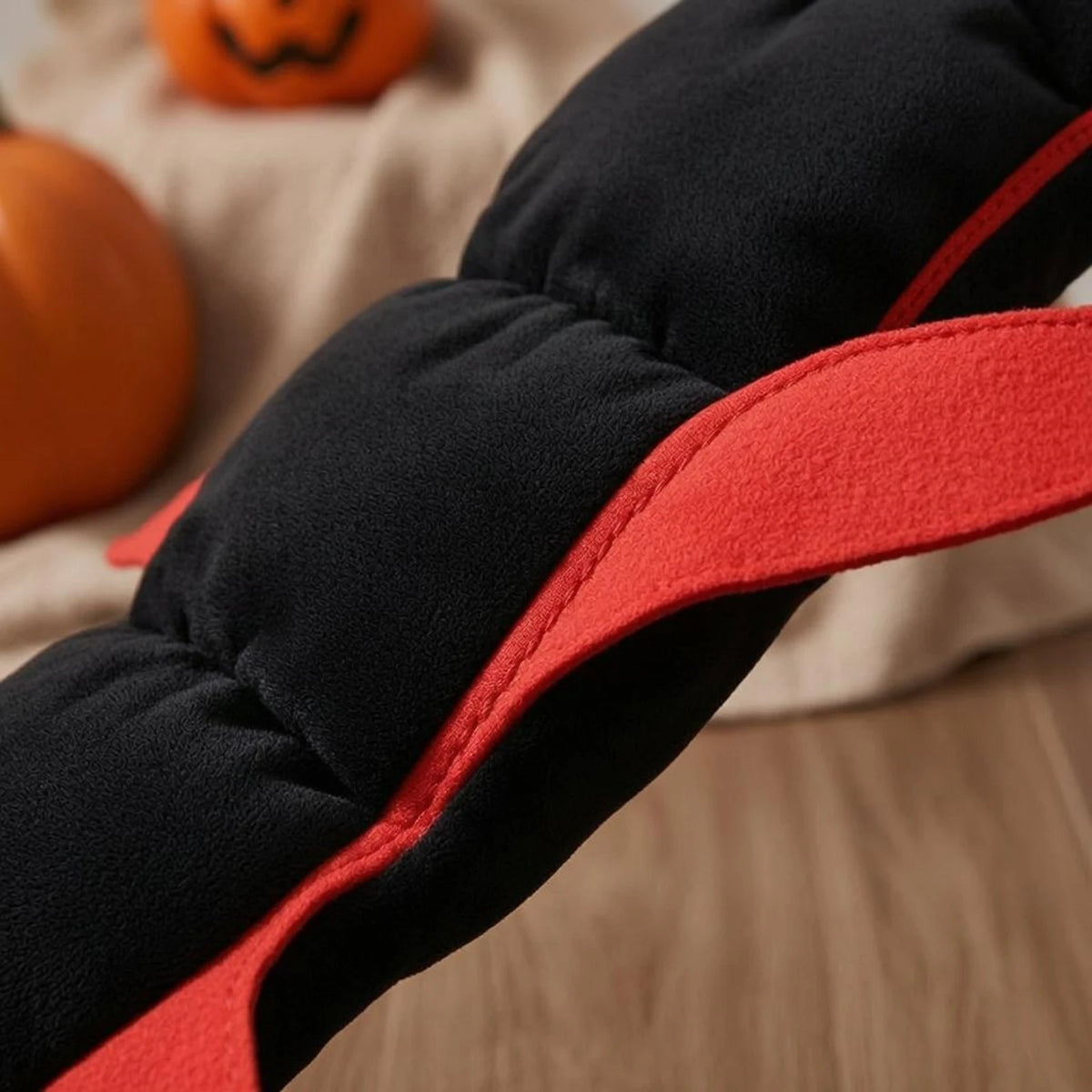 Close-up of the quilted black body and red edging