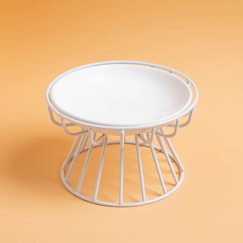White ceramic plate on a white wire stand