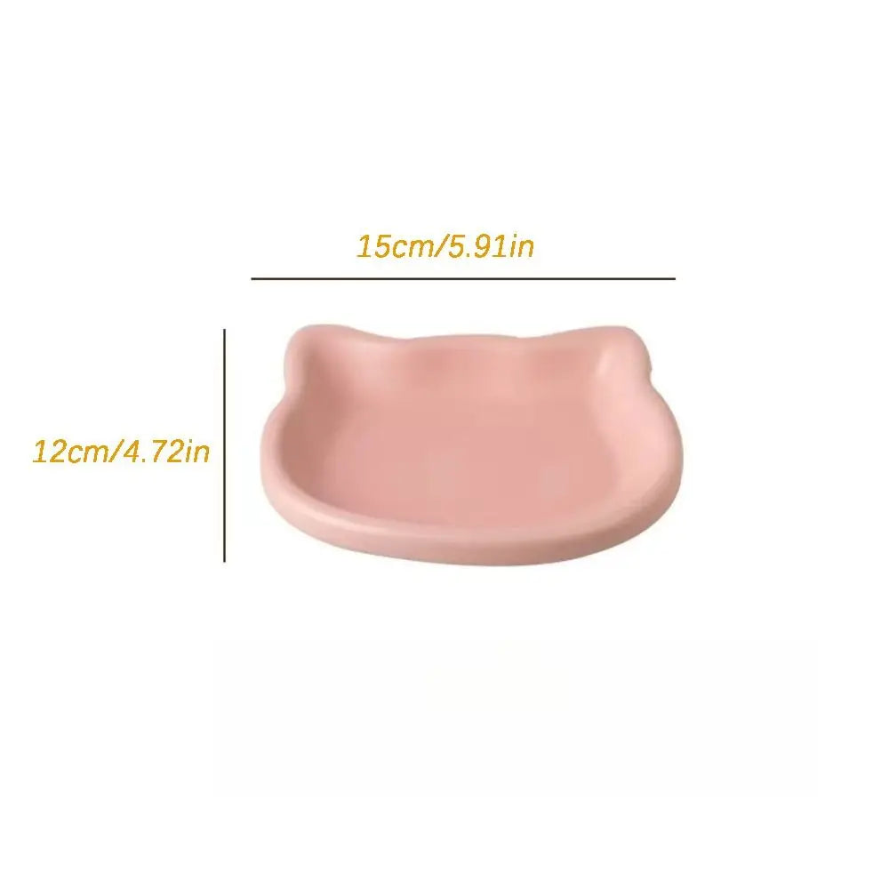 Pink cat-shaped shallow dish seen from above