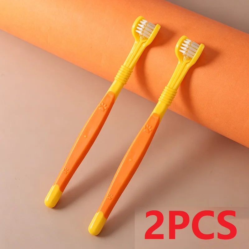 Two yellow and orange toothbrushes