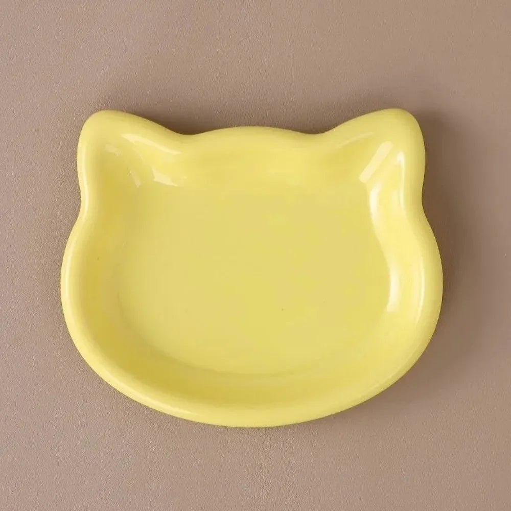 Sage green cat-shaped shallow dish seen from above