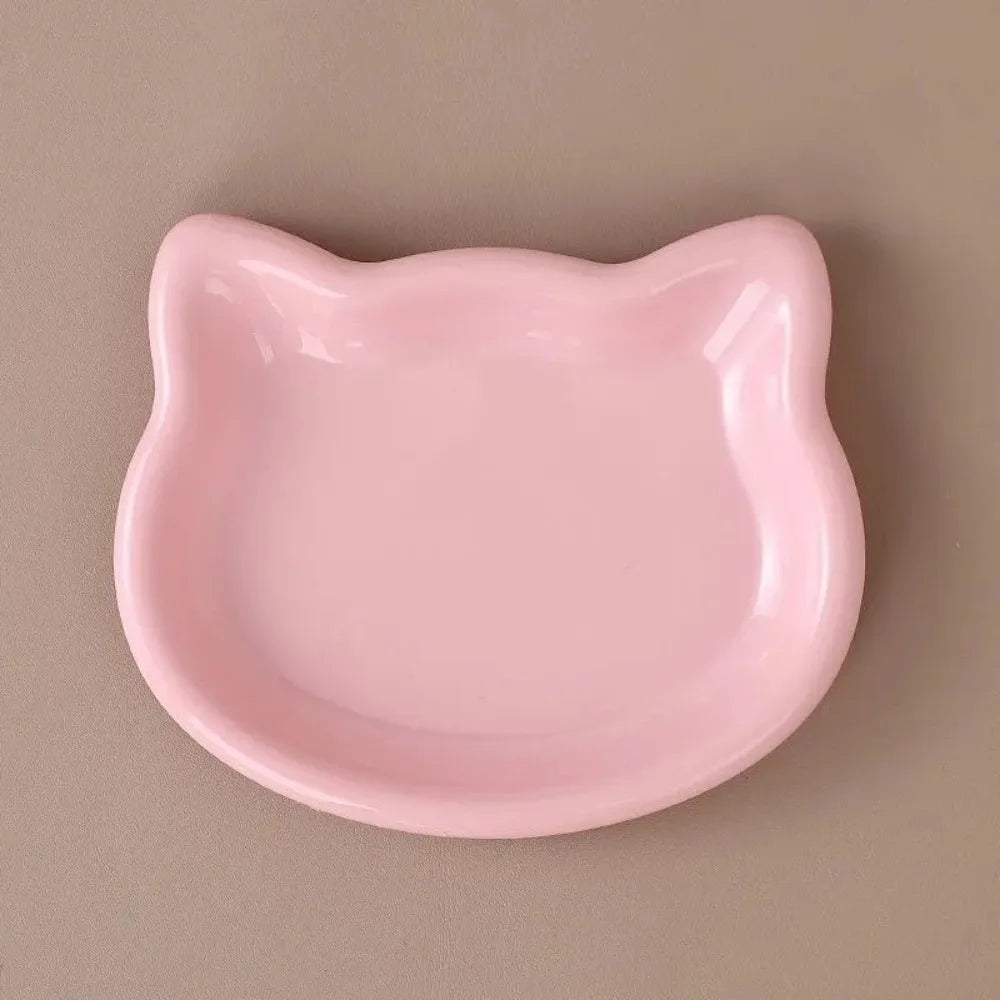 Yellow cat-shaped shallow dish seen from above