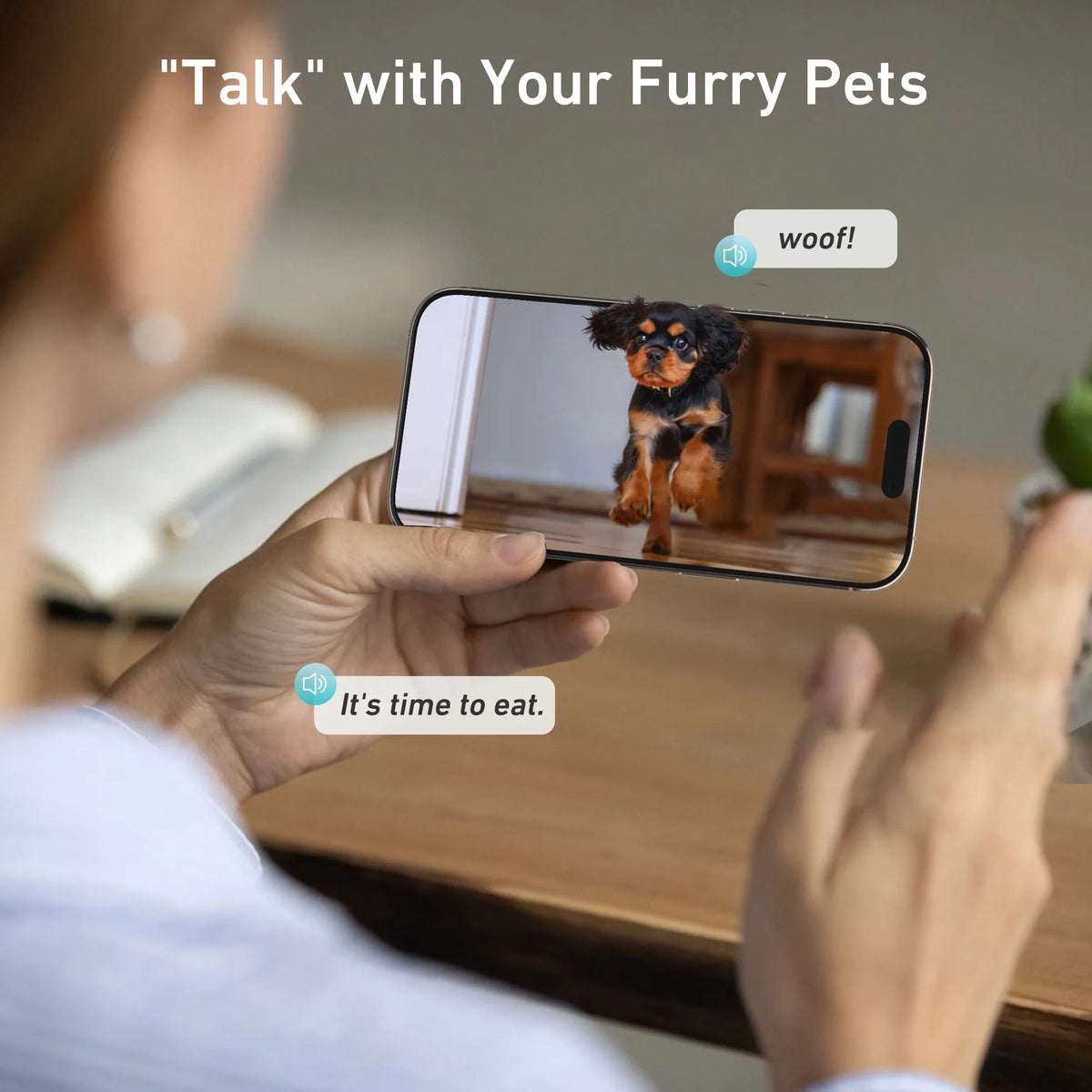Someone speaking to their dog through the feeder camera on a phone