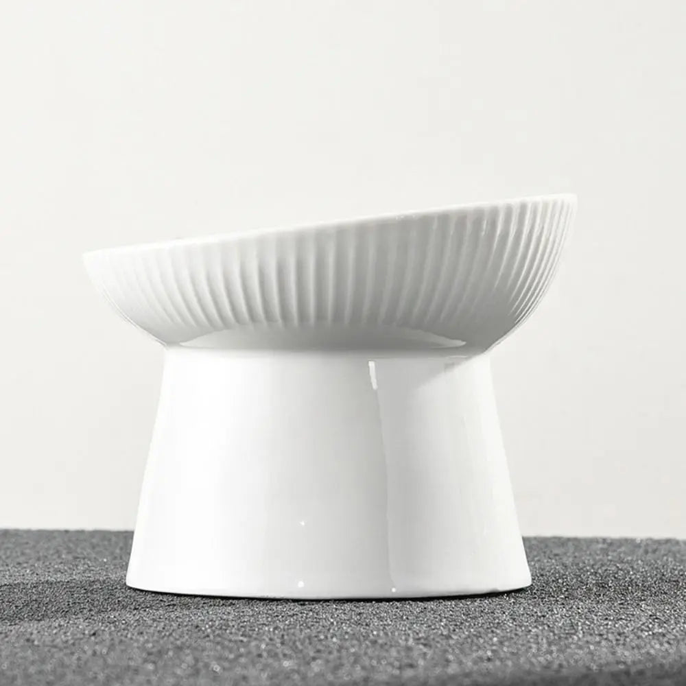 White fluted pedestal bowl with a slanted rim