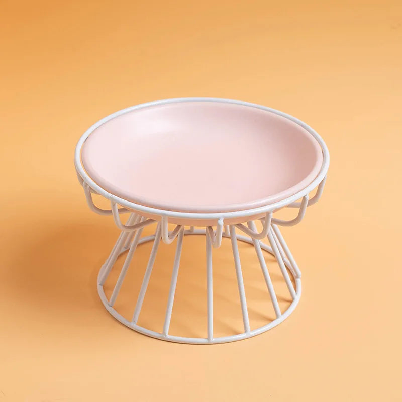Pink ceramic plate on a white wire stand