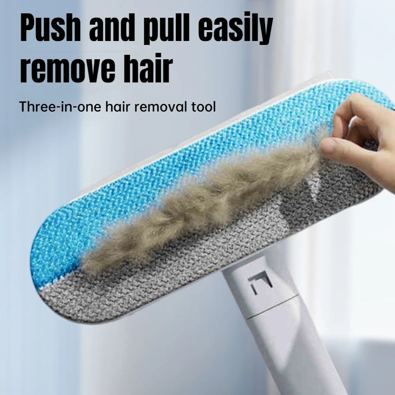 Long-handle pet hair remover lifting hair from a fabric surface