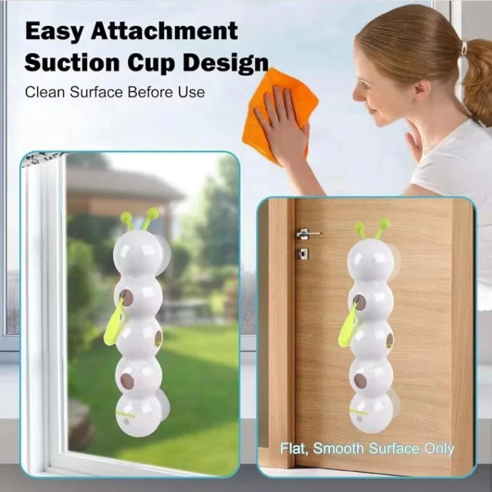 The toy stuck to a window and a door with its suction cups