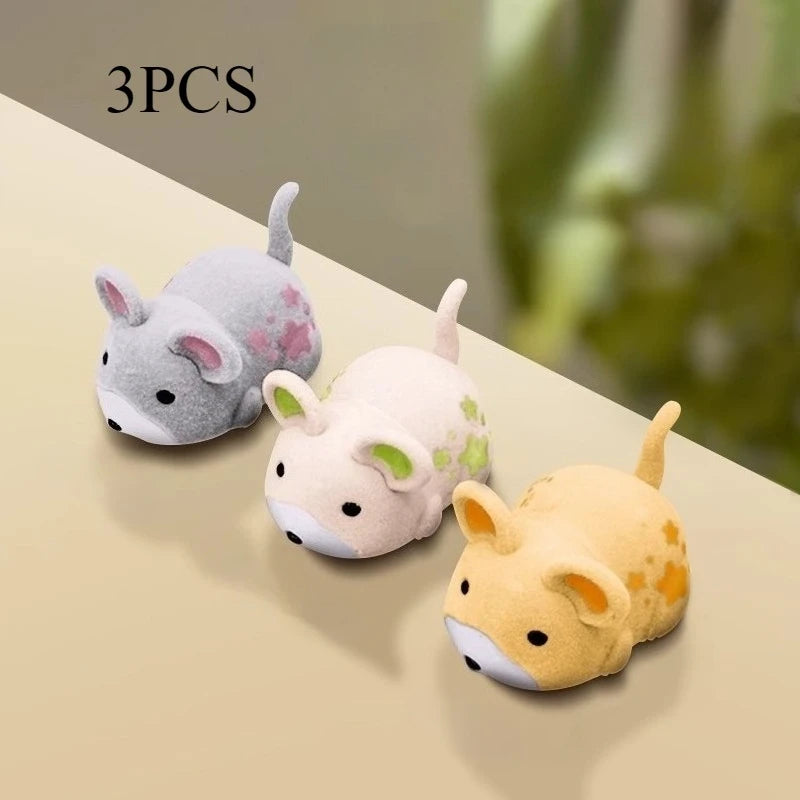 The three-pack: one grey, one green and one yellow mouse