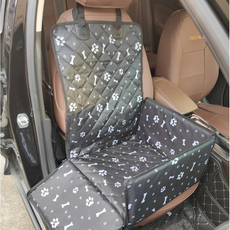 Grey bone-print car seat carrier fitted to a car seat with the sides raised