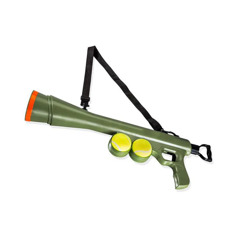 The green launcher with its shoulder strap and two tennis balls