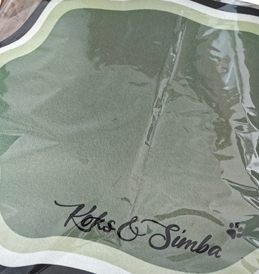 Green personalised feeding mat sealed in its delivery packaging
